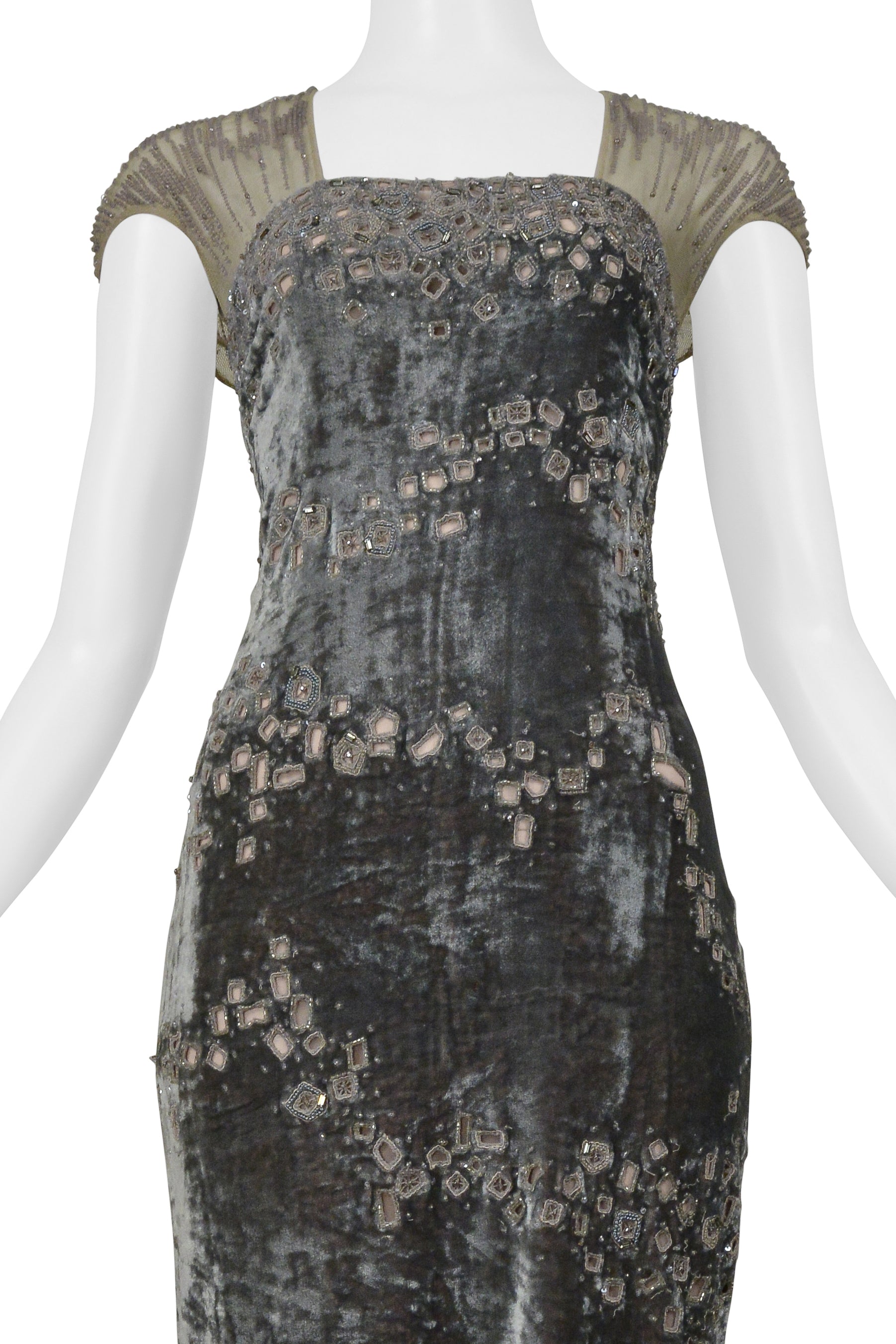 BADGLEY MISCHKA SILVER EVENING GOWN WITH MESH YOKE, BEADING, AND SQUARE CUTOUTS