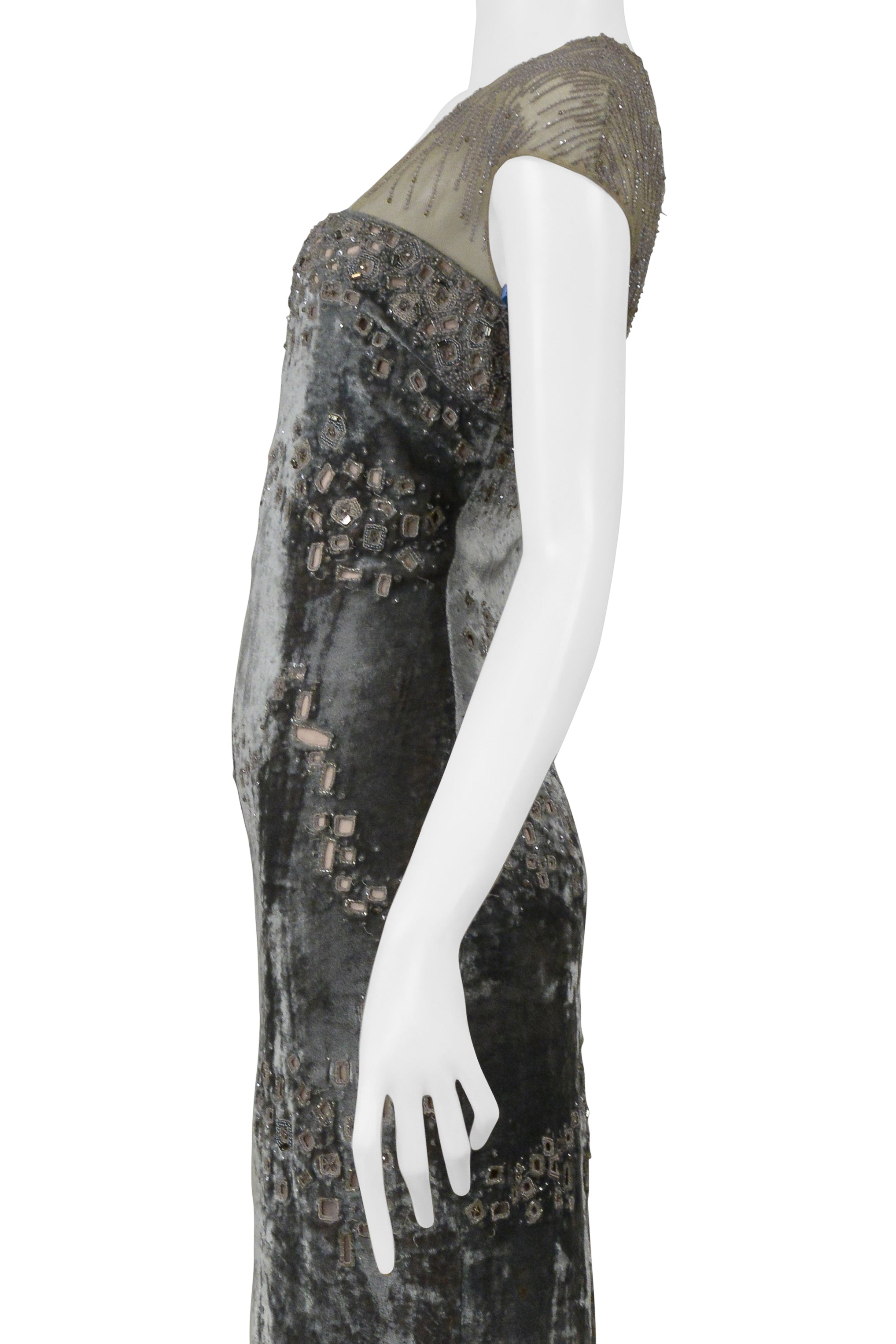 BADGLEY MISCHKA SILVER EVENING GOWN WITH MESH YOKE, BEADING, AND SQUARE CUTOUTS