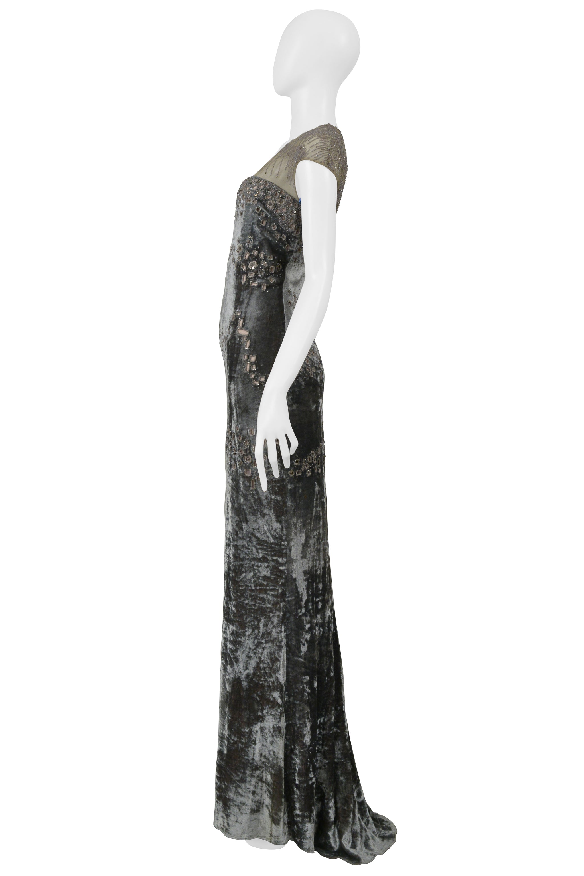 BADGLEY MISCHKA SILVER EVENING GOWN WITH MESH YOKE, BEADING, AND SQUARE CUTOUTS