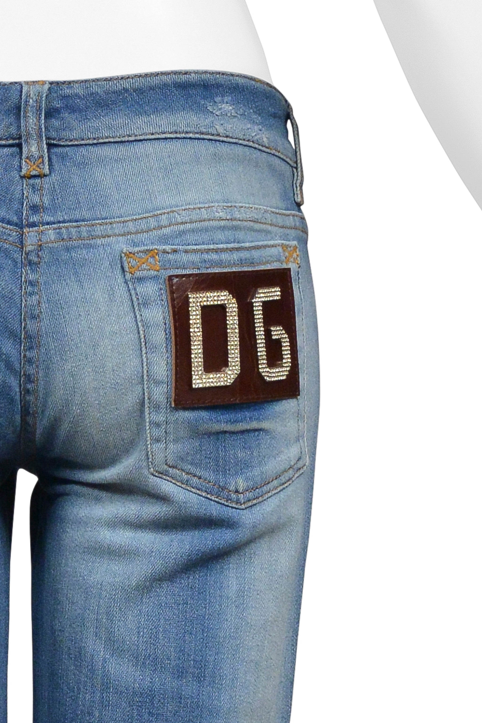 DOLCE & GABBANA DISTRESSED BLUE DENIM JEANS WITH RHINESTONE D&G BADGE