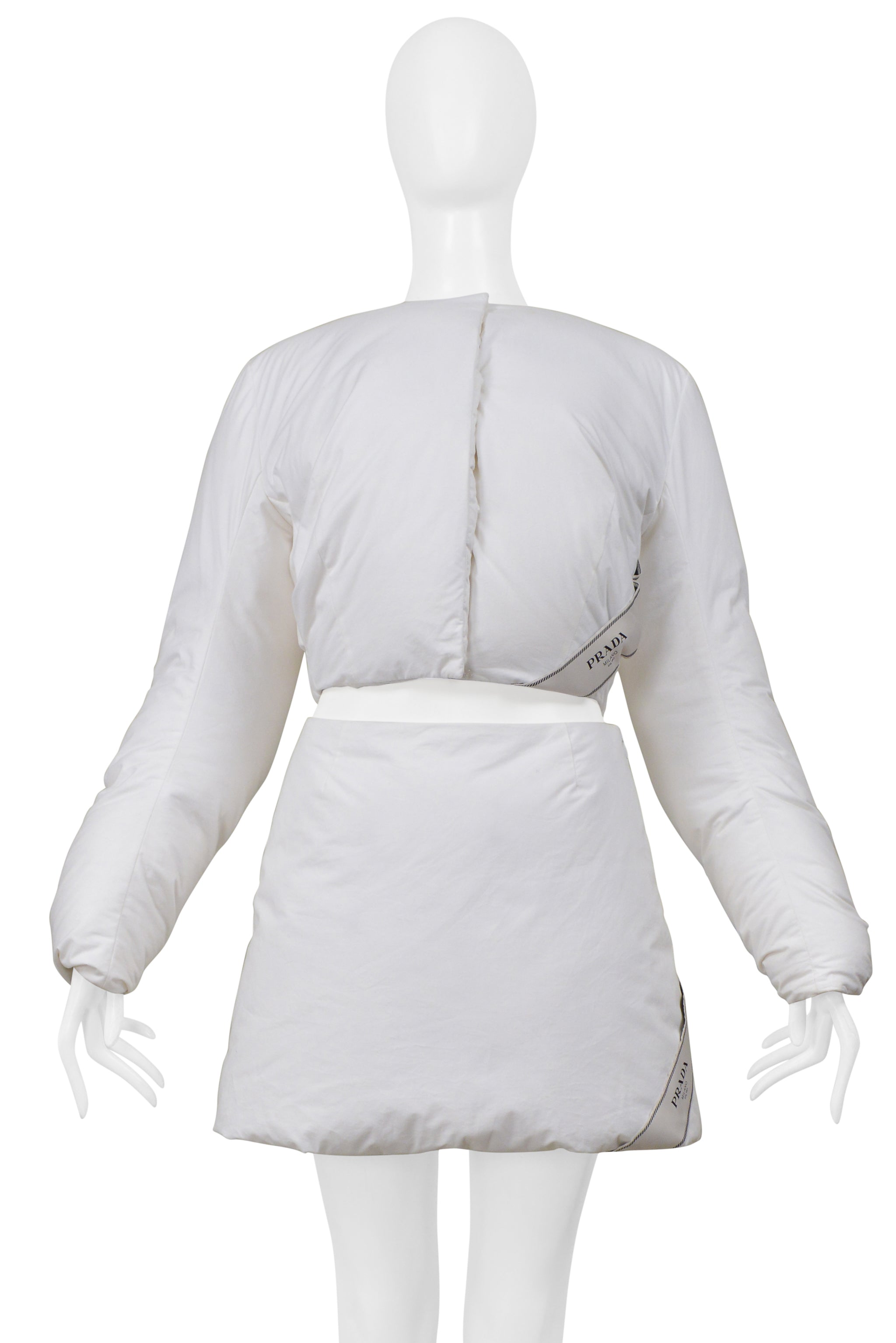 PRADA BY RAF SIMONS WHITE COTTON PADDED JACKET AND MINI SKIRT 2023