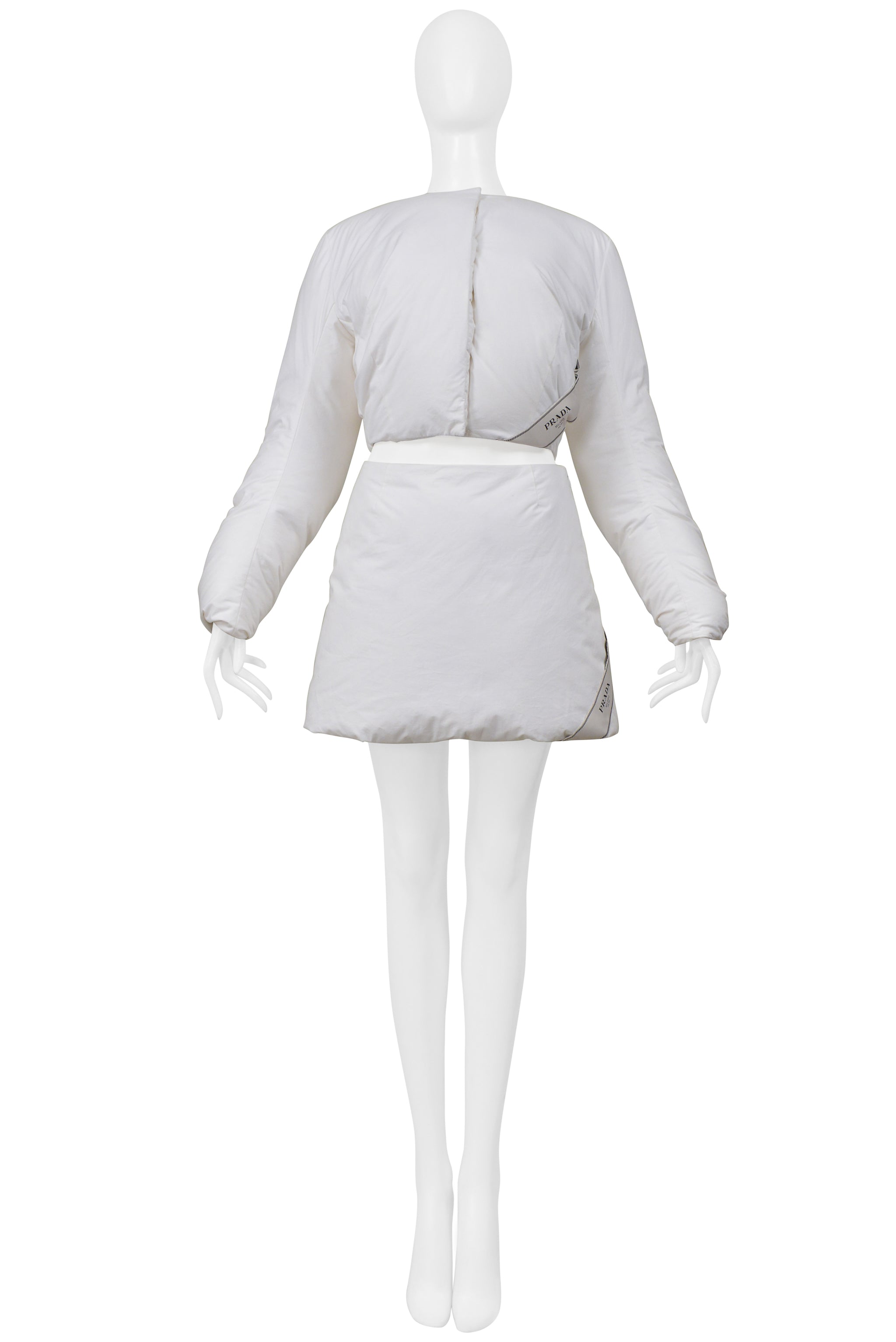 PRADA BY RAF SIMONS WHITE COTTON PADDED JACKET AND MINI SKIRT 2023