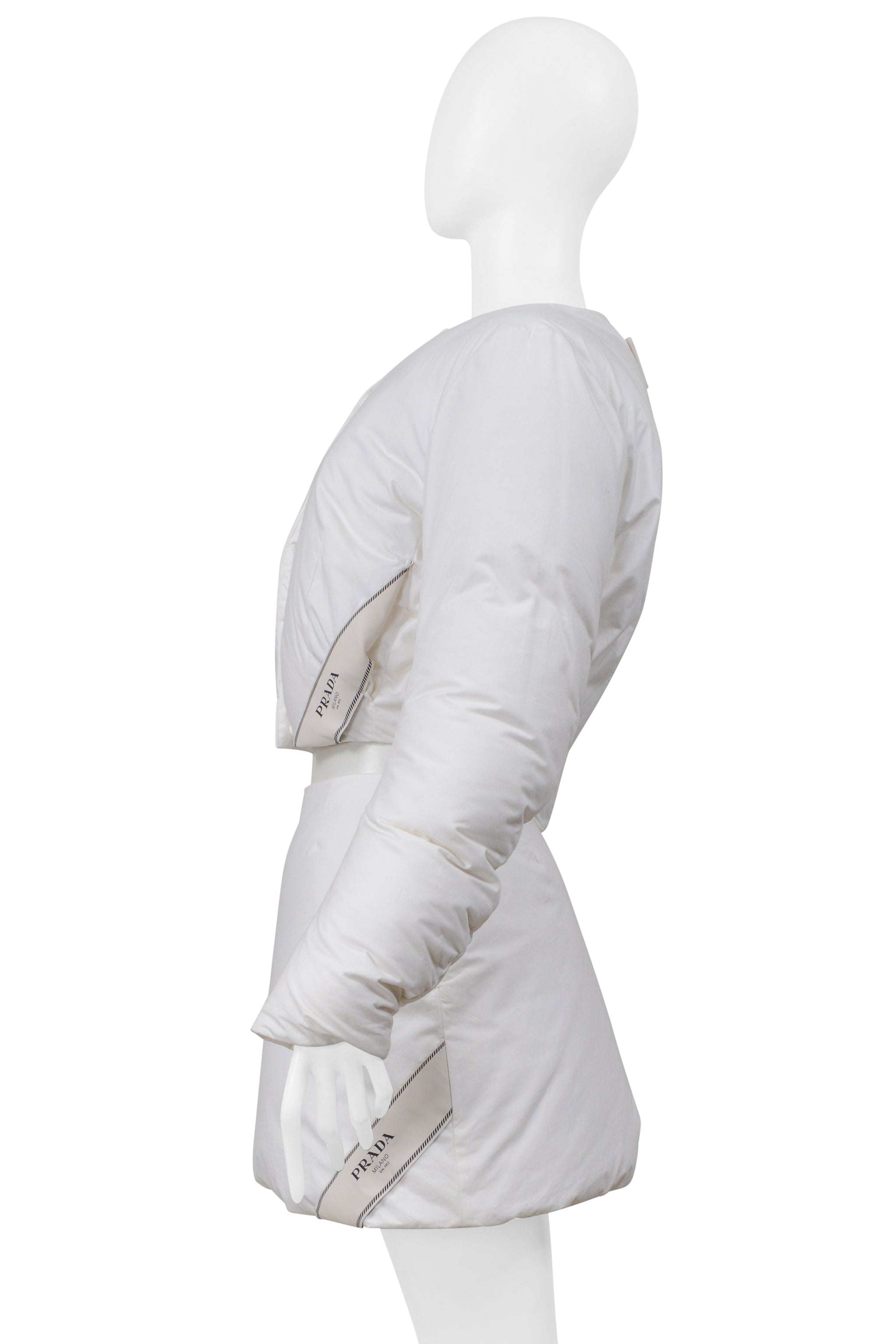 PRADA BY RAF SIMONS WHITE COTTON PADDED JACKET AND MINI SKIRT 2023