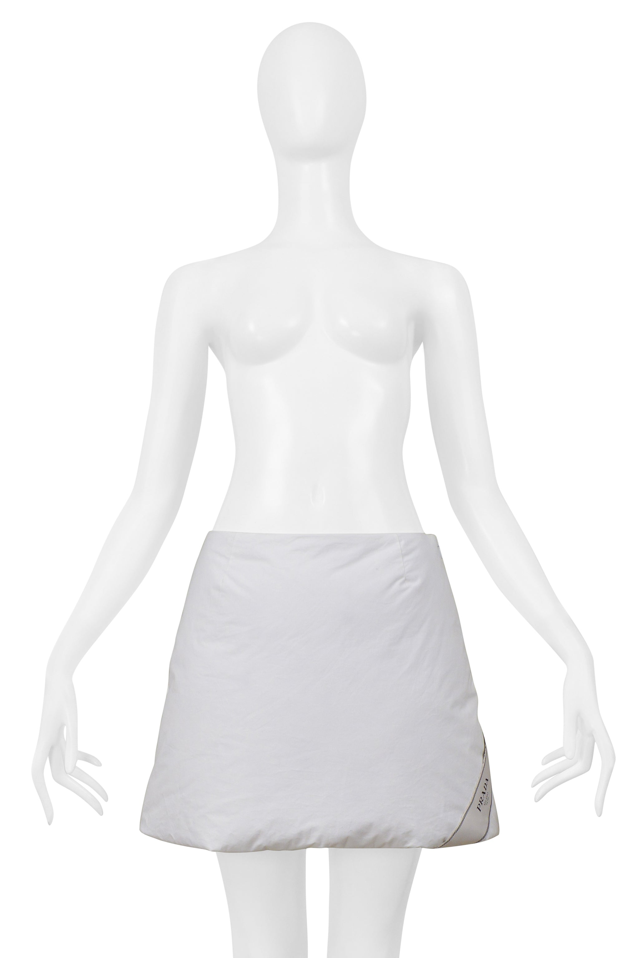 PRADA BY RAF SIMONS WHITE COTTON PADDED JACKET AND MINI SKIRT 2023