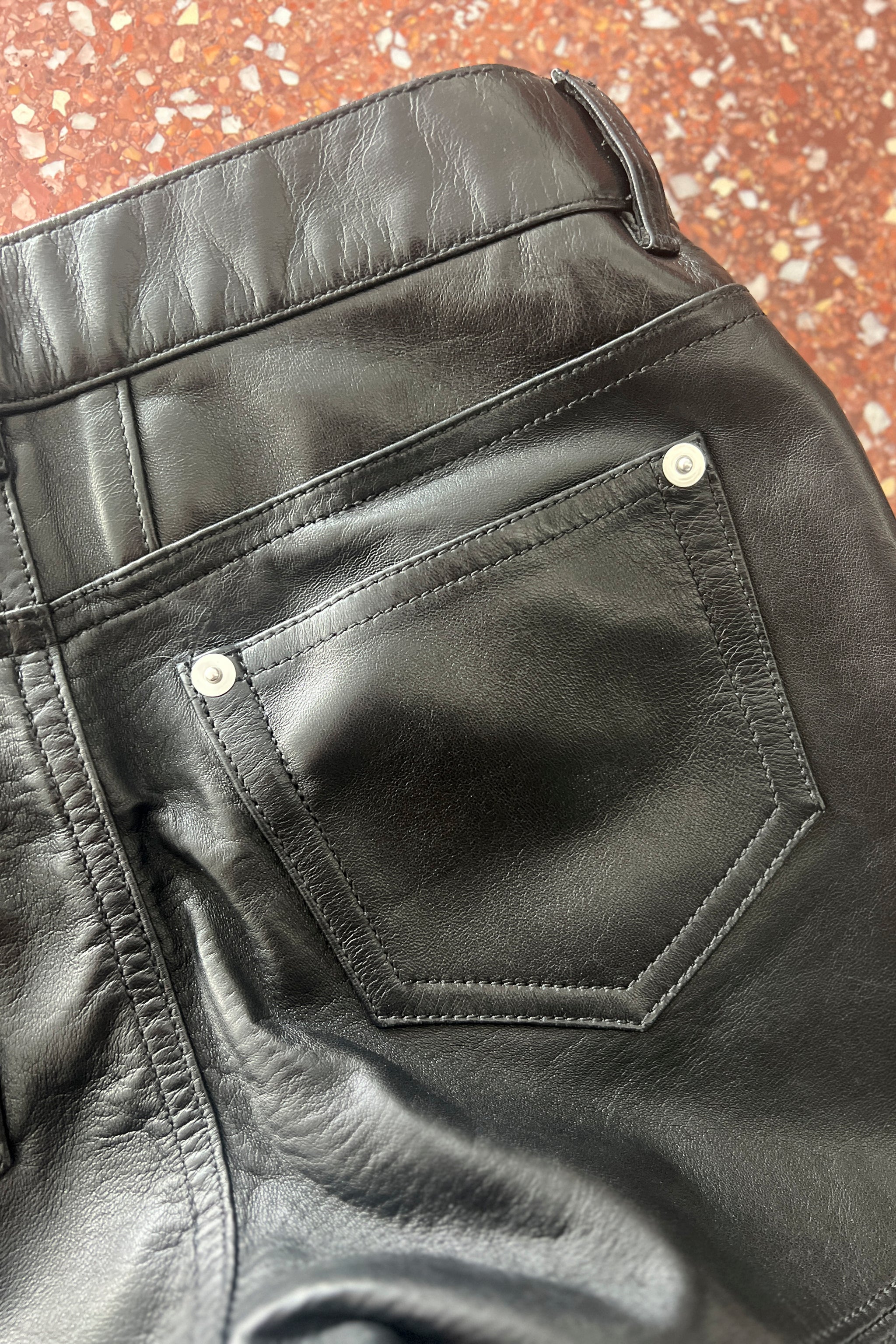 SAINT LAURENT PARIS BY HEDI SLIMANE BLACK LEATHER PANTS SLITS