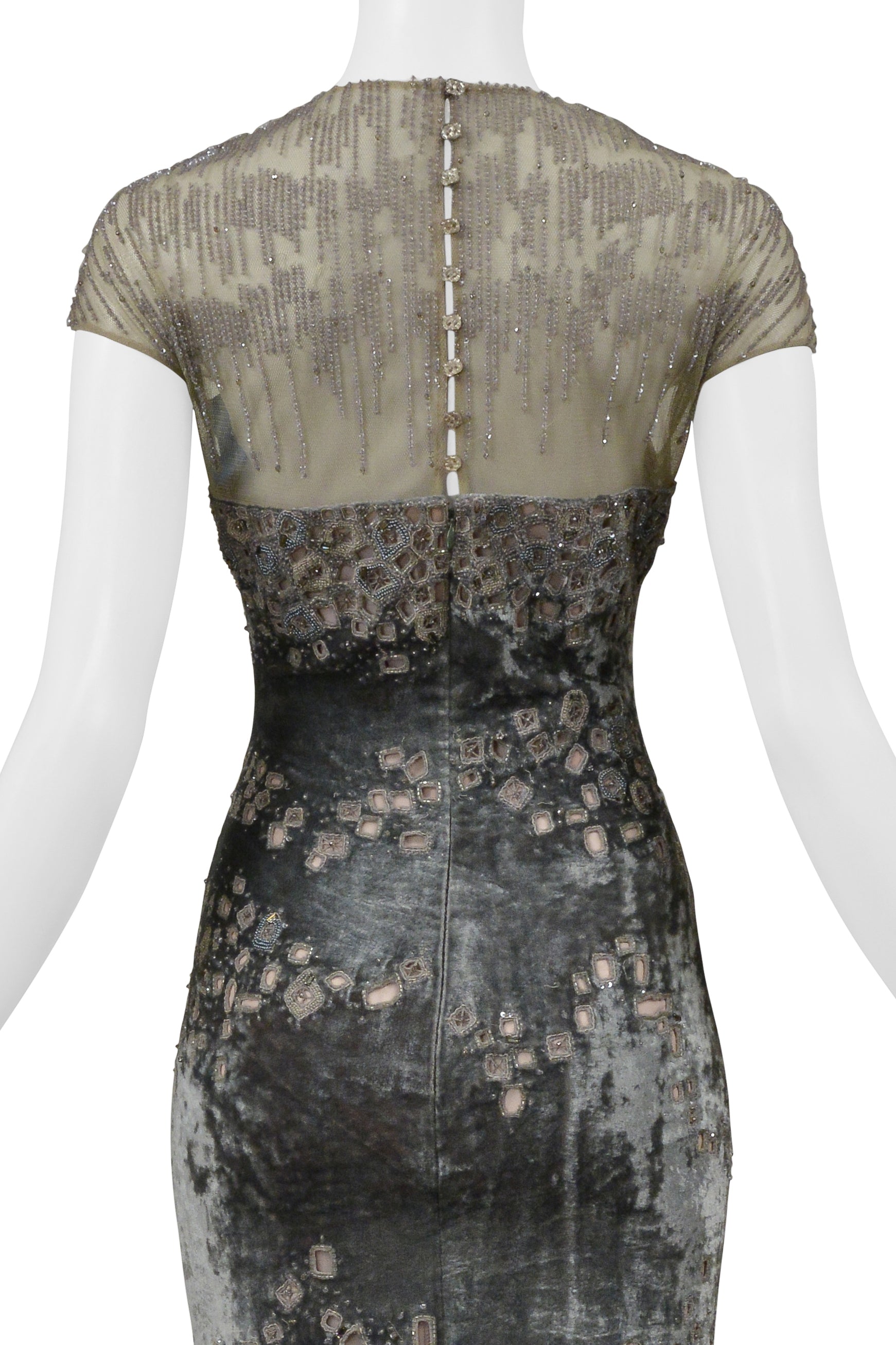 BADGLEY MISCHKA SILVER EVENING GOWN WITH MESH YOKE, BEADING, AND SQUARE CUTOUTS