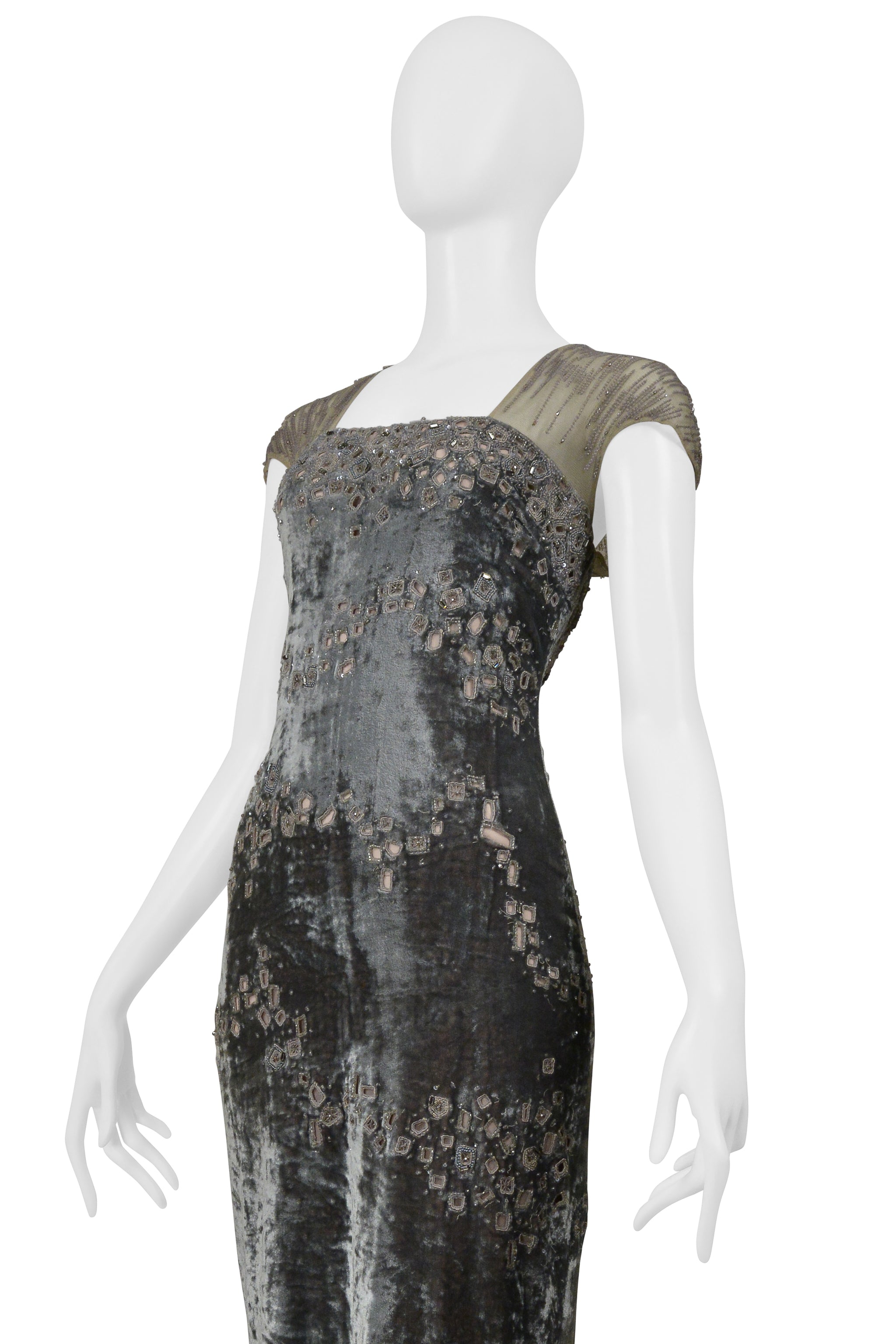 BADGLEY MISCHKA SILVER EVENING GOWN WITH MESH YOKE, BEADING, AND SQUARE CUTOUTS