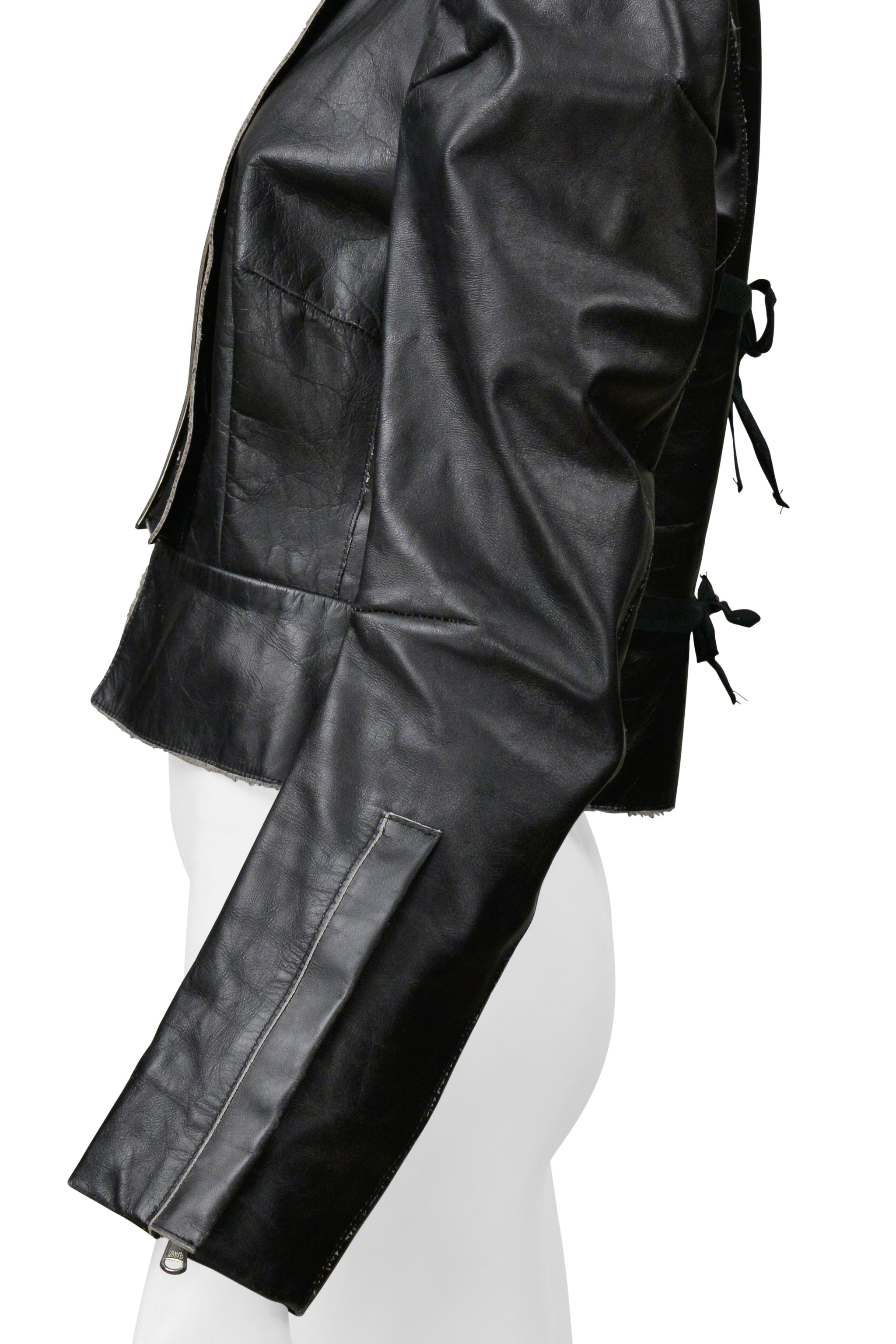 MAISON MARTIN MARGIELA BLACK DISTRESSED LEATHER JACKET WITH LARGE BUCKLE AND TIES 1990S