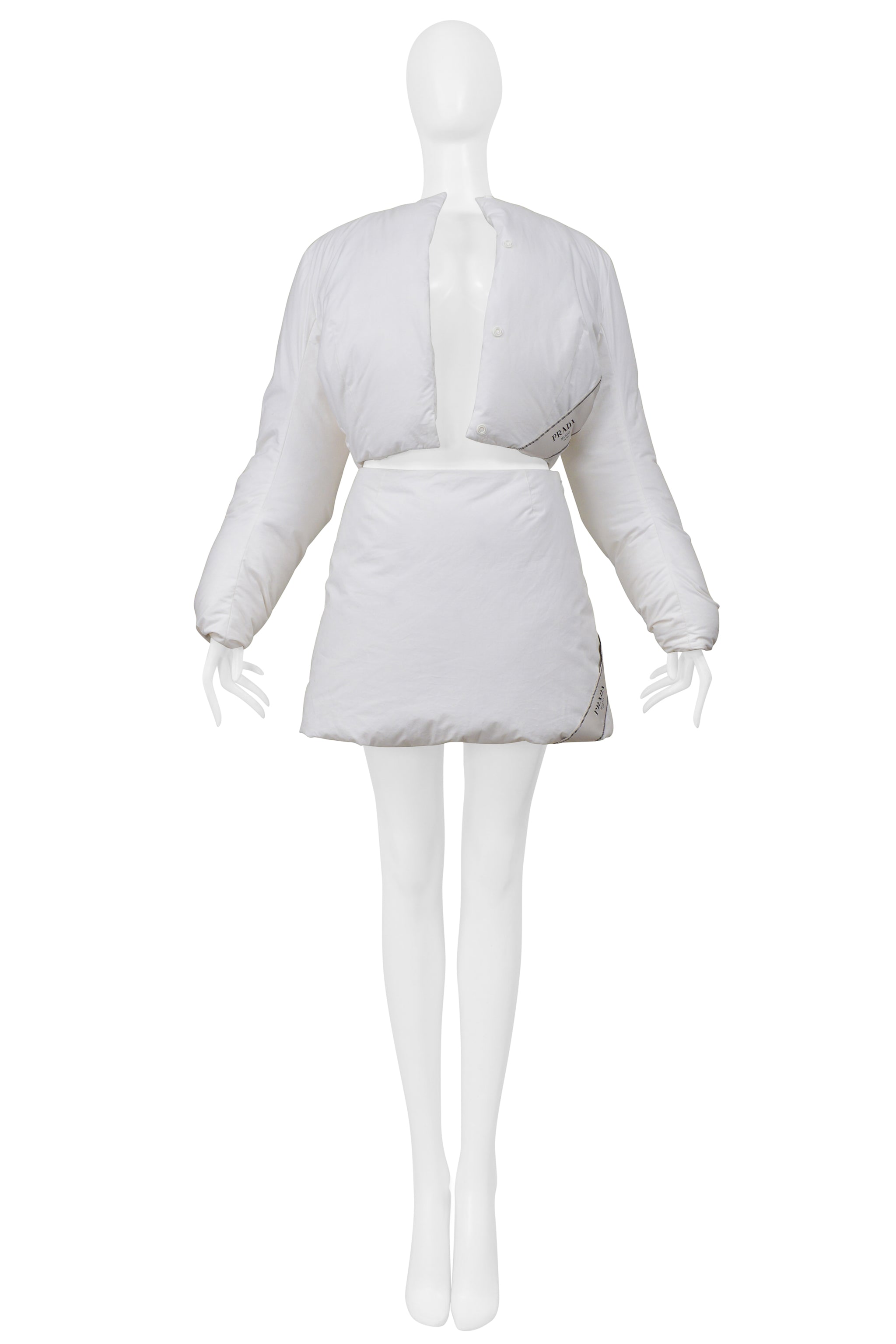 PRADA BY RAF SIMONS WHITE COTTON PADDED JACKET AND MINI SKIRT 2023