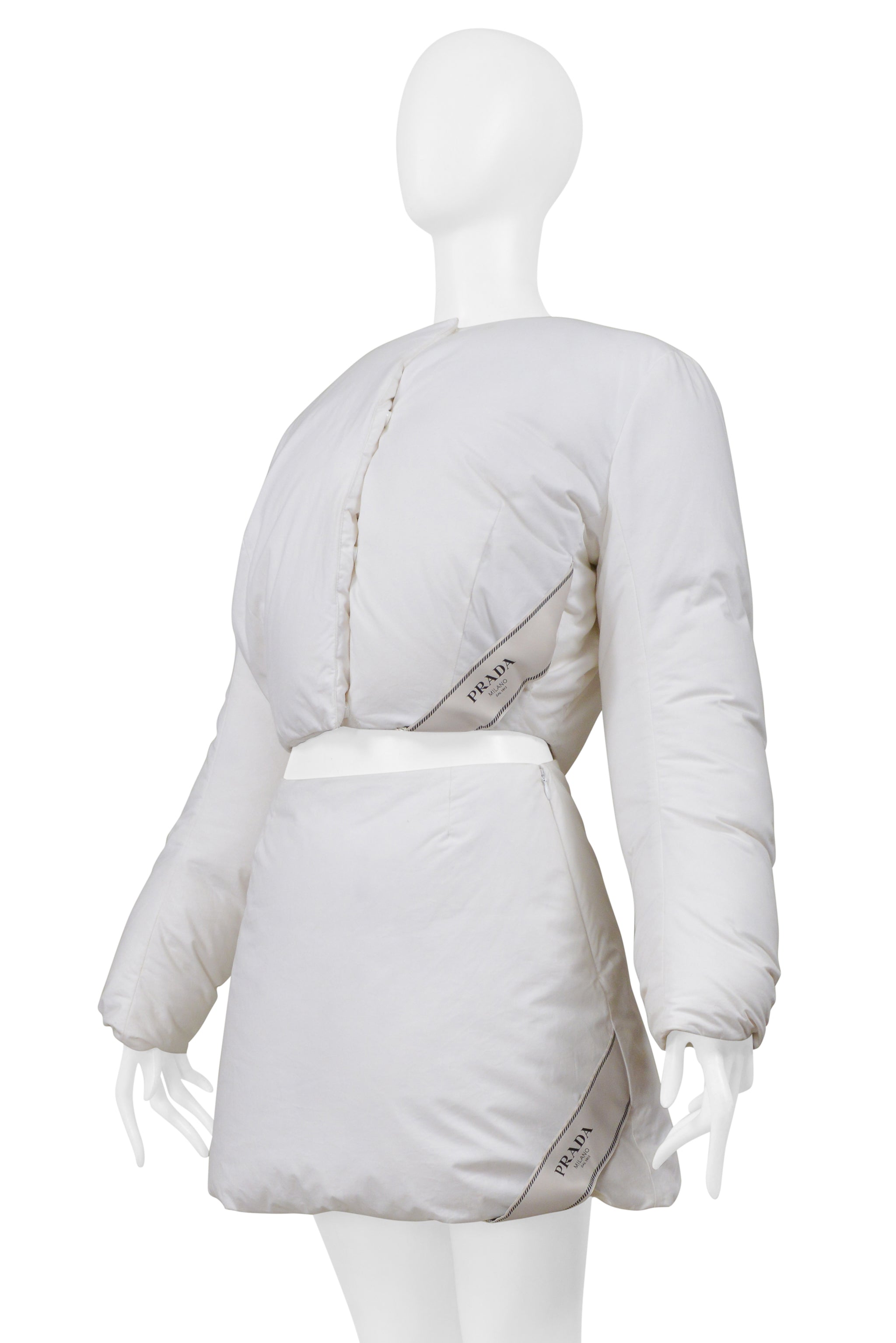 PRADA BY RAF SIMONS WHITE COTTON PADDED JACKET AND MINI SKIRT 2023