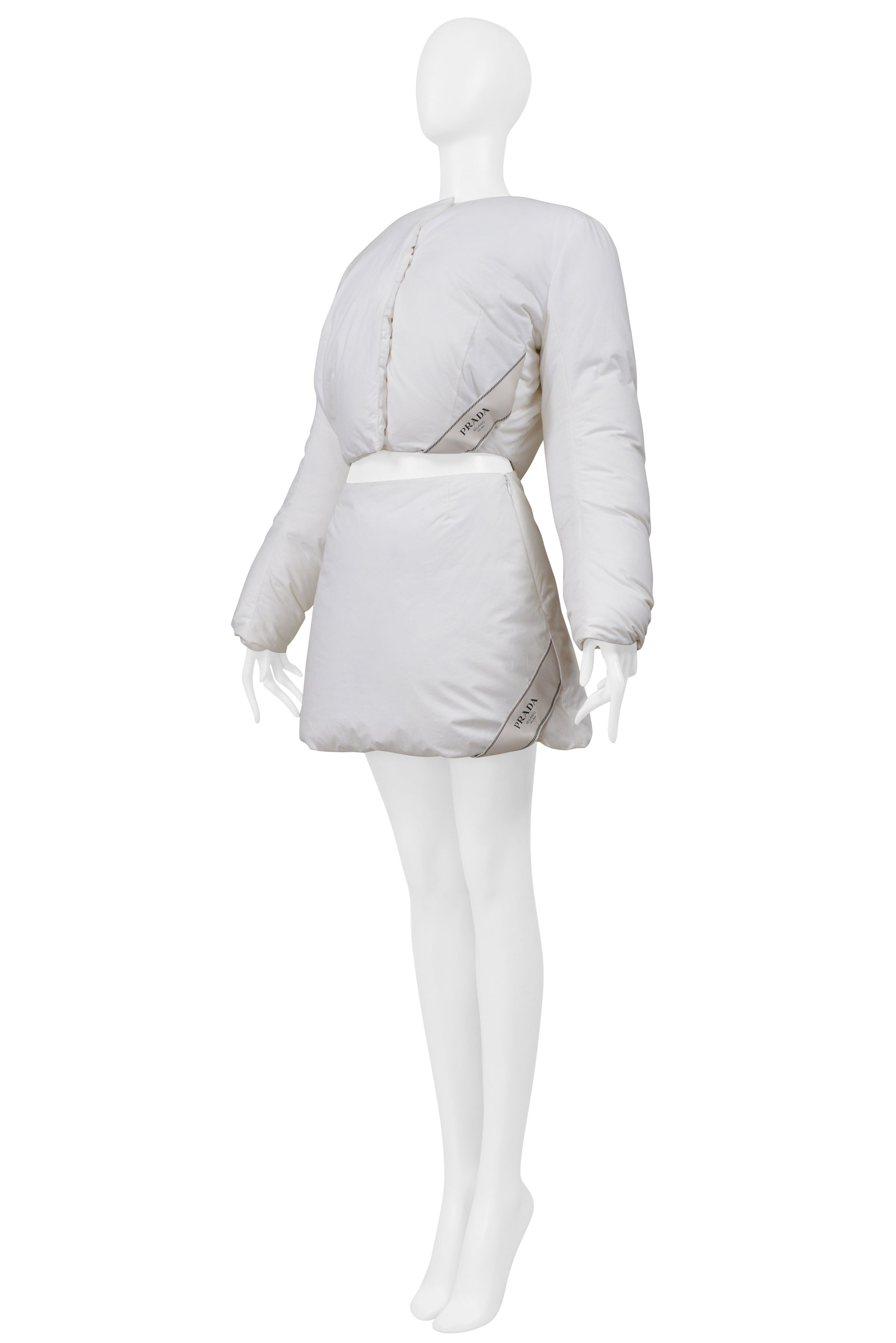 PRADA BY RAF SIMONS WHITE COTTON PADDED JACKET AND MINI SKIRT 2023