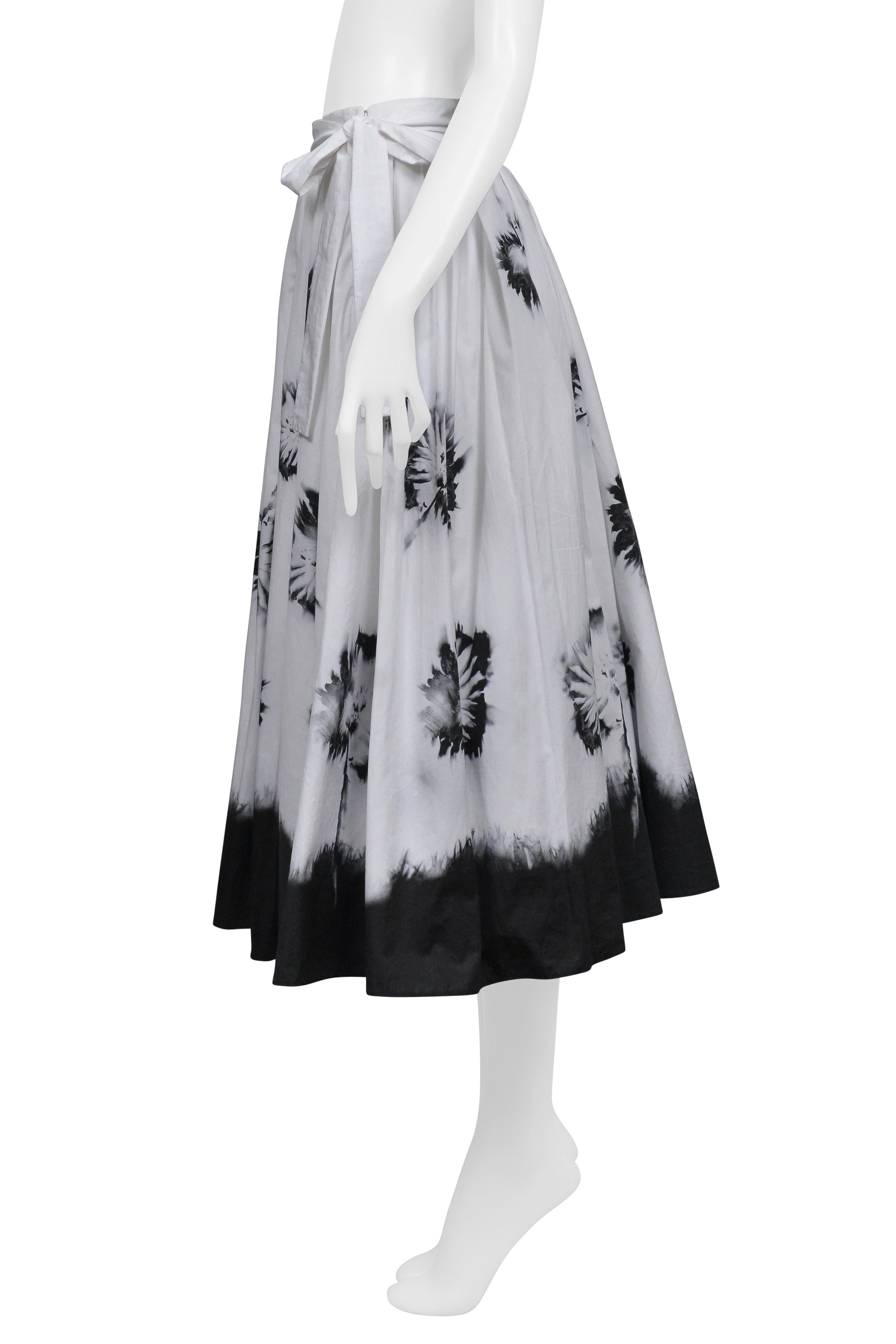 PRADA WHITE SKIRT WITH BLACK FLOWERS AND DIPPED HEM
