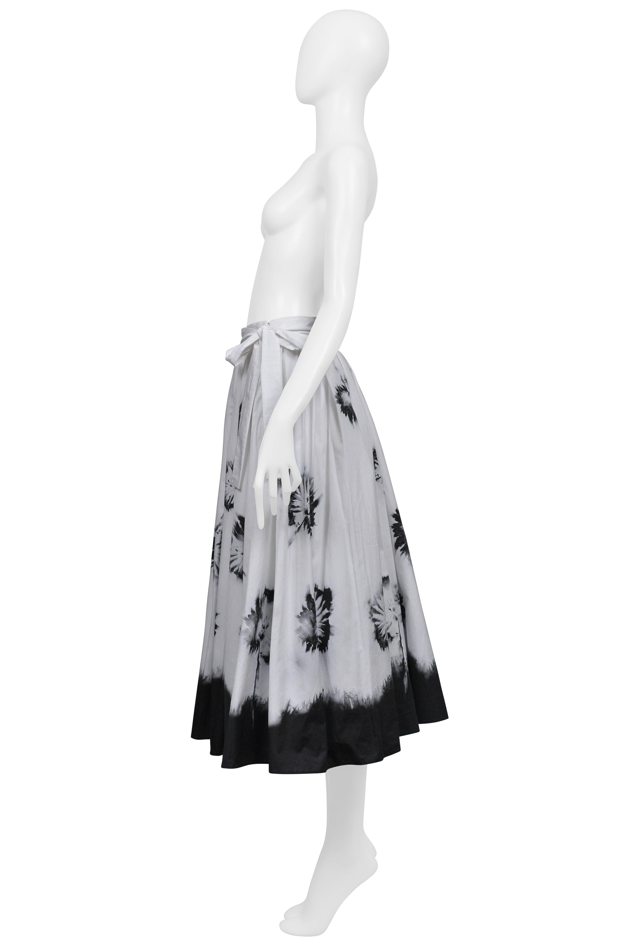PRADA WHITE SKIRT WITH BLACK FLOWERS AND DIPPED HEM