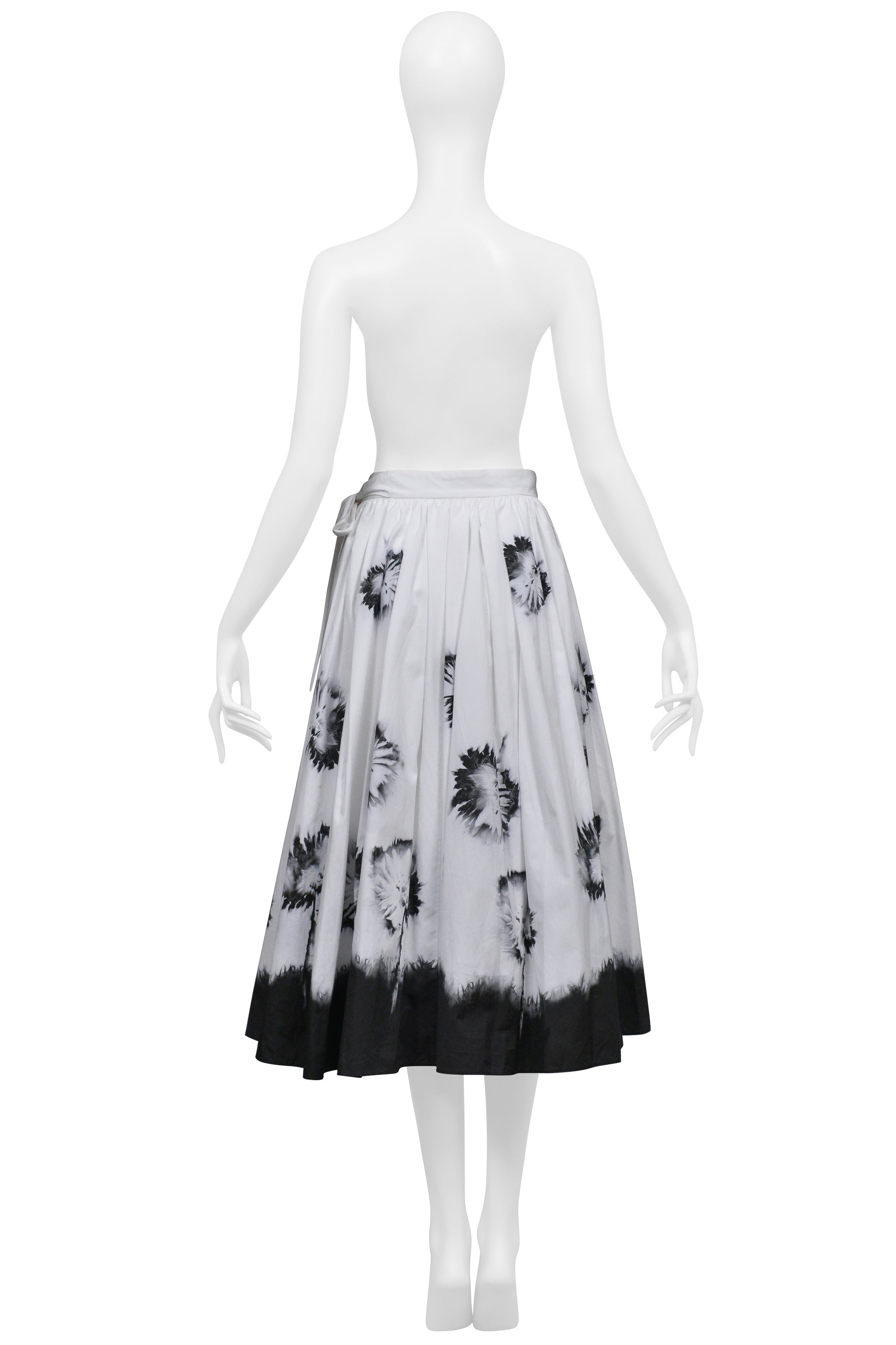 PRADA WHITE SKIRT WITH BLACK FLOWERS AND DIPPED HEM